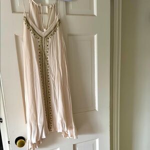 Cream Dress with Gold Embellishments. Straps adjustable as they tie in back